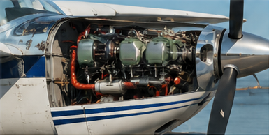 Small piston airplane powerplant with the cowlings off.